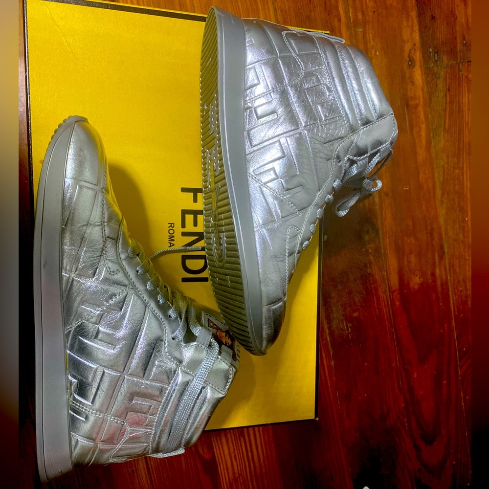 Fendi high top sneakers.